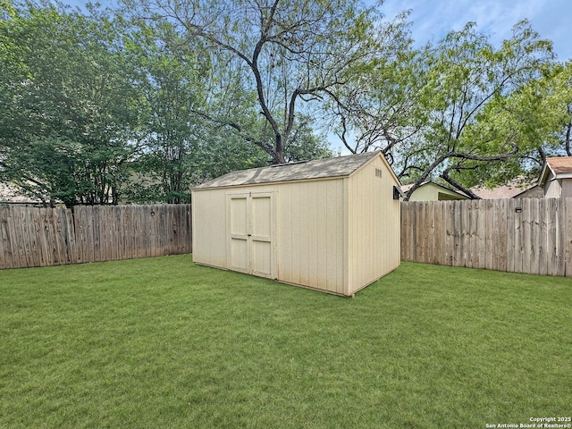 view of shed with a fenced backyard