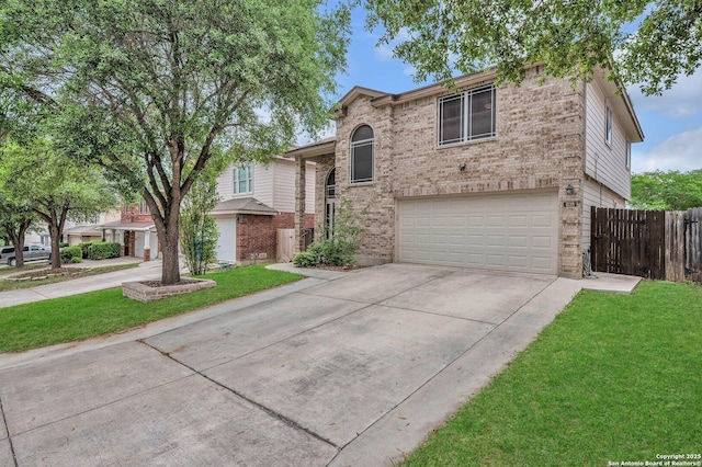view of front of home featuring a garage, fence, concrete driveway, and a front yard