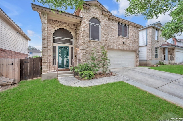 view of front of home featuring driveway, brick siding, fence, a front lawn, and an attached garage