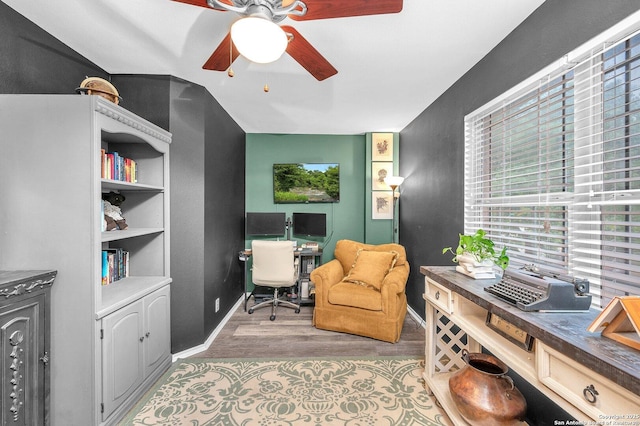 home office featuring baseboards, ceiling fan, and wood finished floors