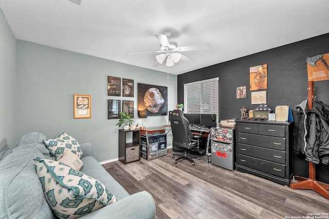 home office with baseboards, a ceiling fan, and wood finished floors