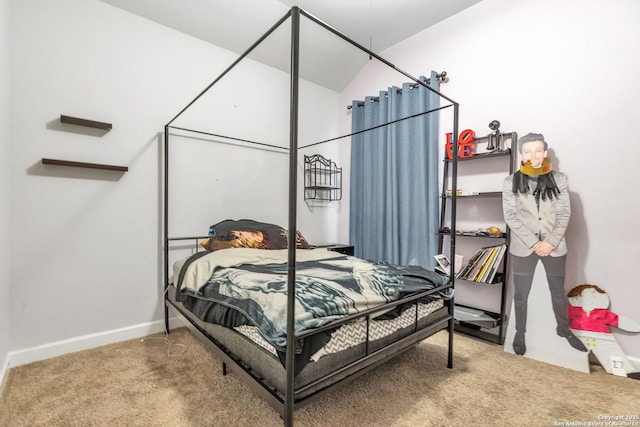 bedroom featuring carpet floors, baseboards, and vaulted ceiling