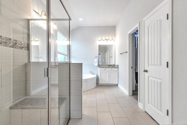 bathroom featuring vanity, baseboards, recessed lighting, a freestanding bath, and a stall shower