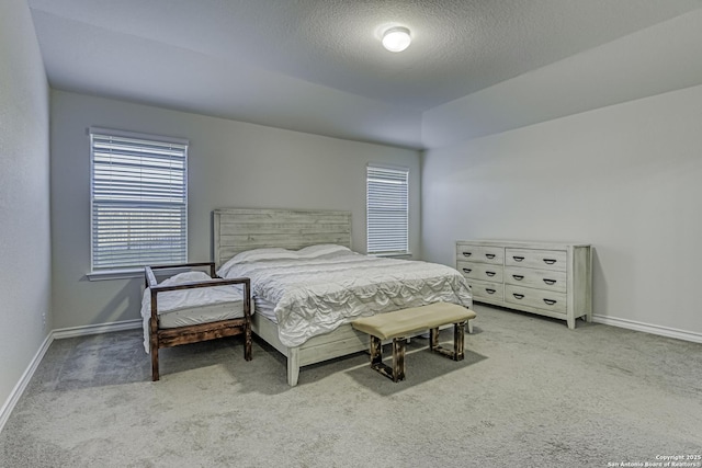 carpeted bedroom with baseboards