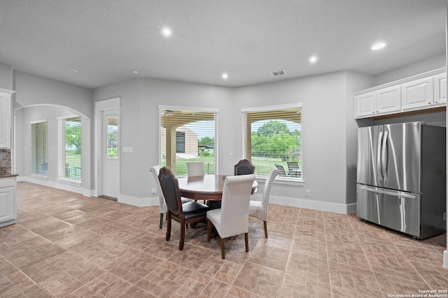dining space featuring baseboards, recessed lighting, and visible vents