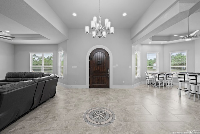 foyer featuring recessed lighting, baseboards, and ceiling fan with notable chandelier