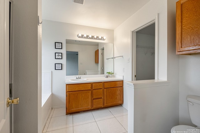 full bath featuring vanity, a bathing tub, toilet, tile patterned floors, and visible vents