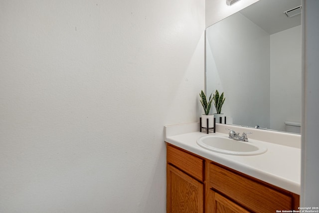 bathroom with visible vents and vanity