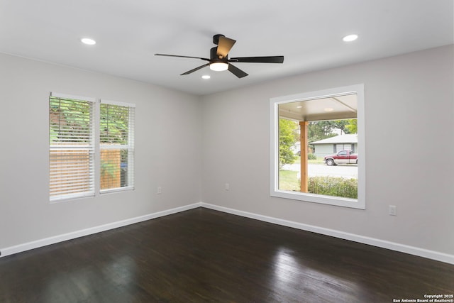 unfurnished room featuring recessed lighting, baseboards, ceiling fan, and dark wood-type flooring