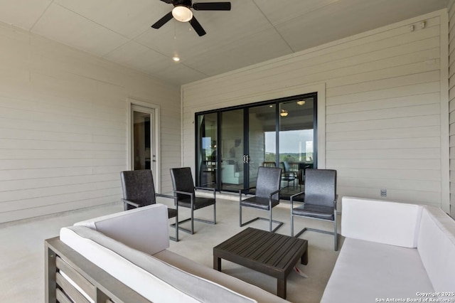 view of patio / terrace with an outdoor living space and ceiling fan