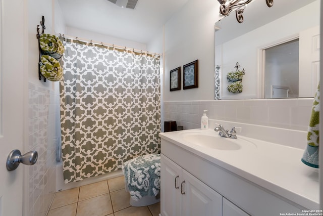 132 Clearview, Canyon Lake, TX 78133 - bathroom featuring tile walls, curtained shower, tile patterned flooring, and vanity