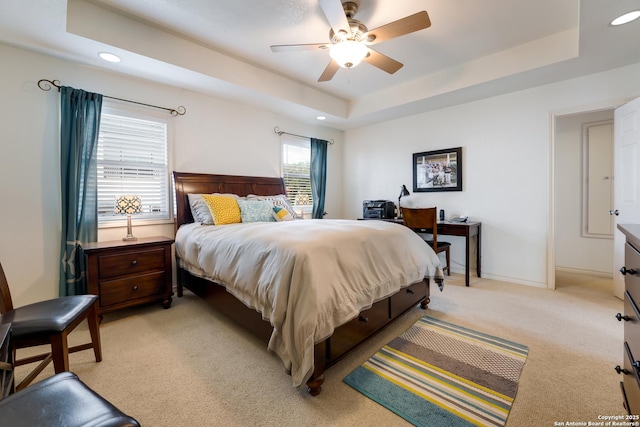 132 Clearview, Canyon Lake, TX 78133 - bedroom with baseboards, light colored carpet, recessed lighting, a raised ceiling, and a ceiling fan