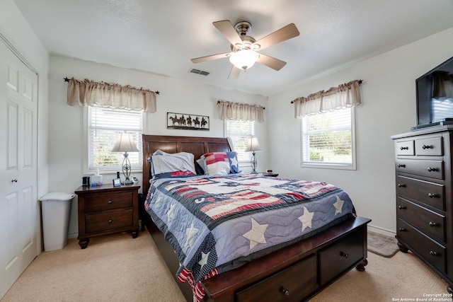 132 Clearview, Canyon Lake, TX 78133 - bedroom with light colored carpet, a ceiling fan, and visible vents