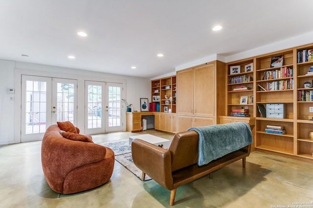 living area featuring recessed lighting, concrete floors, and french doors