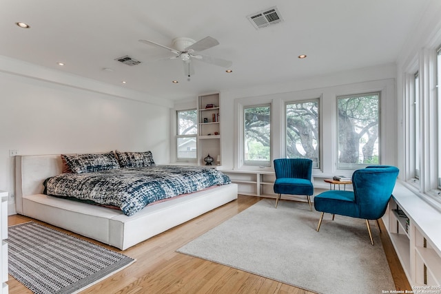 bedroom featuring recessed lighting, visible vents, and wood finished floors