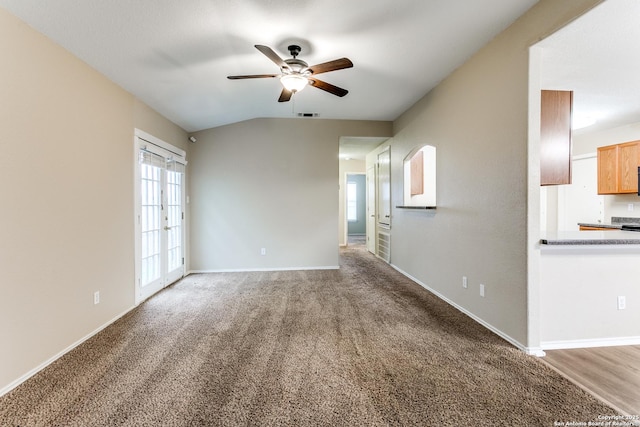 interior space featuring baseboards, carpet, a ceiling fan, and visible vents
