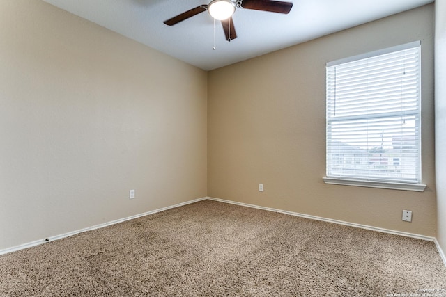 spare room with plenty of natural light, baseboards, ceiling fan, and carpet flooring