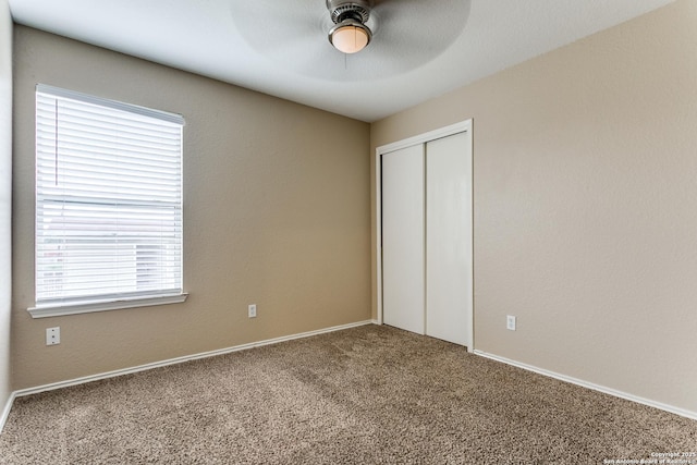 2131 Wood Rnch, San Antonio, TX 78227 - unfurnished bedroom featuring carpet, a closet, a ceiling fan, and baseboards