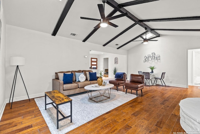 living area with wood-type flooring, a ceiling fan, baseboards, vaulted ceiling with beams, and visible vents