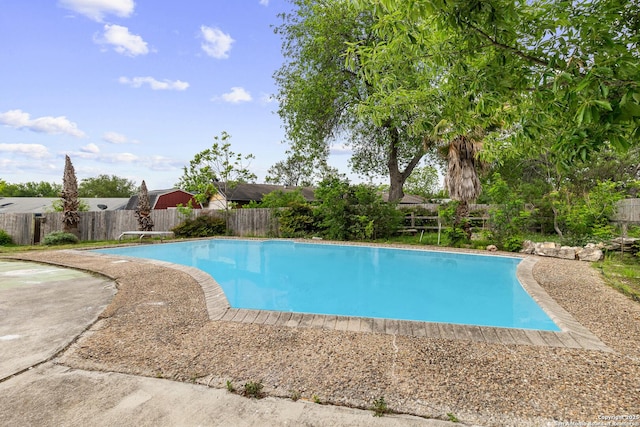 view of swimming pool with a fenced in pool and a fenced backyard