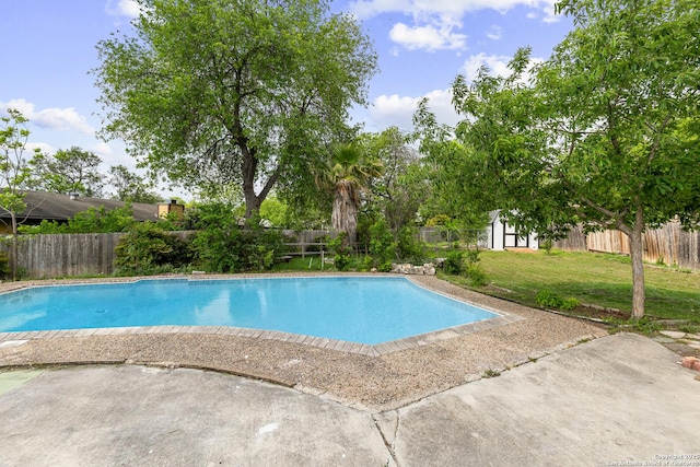 view of pool featuring a fenced backyard, a fenced in pool, a yard, and a patio area