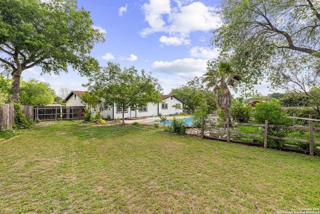 view of yard featuring a fenced backyard and a fenced in pool