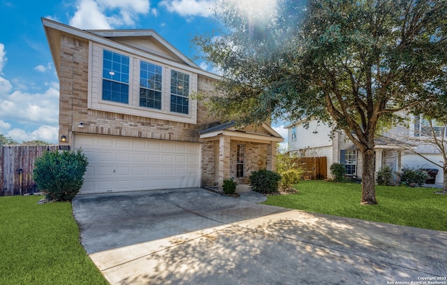 traditional home with brick siding, fence, a front lawn, concrete driveway, and an attached garage