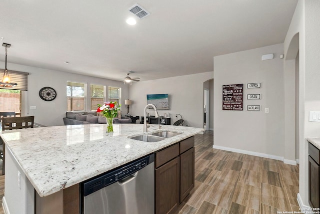 7914 Blackhawk Pass, San Antonio, TX 78253 - kitchen with dishwasher, a sink, arched walkways, open floor plan, and ceiling fan