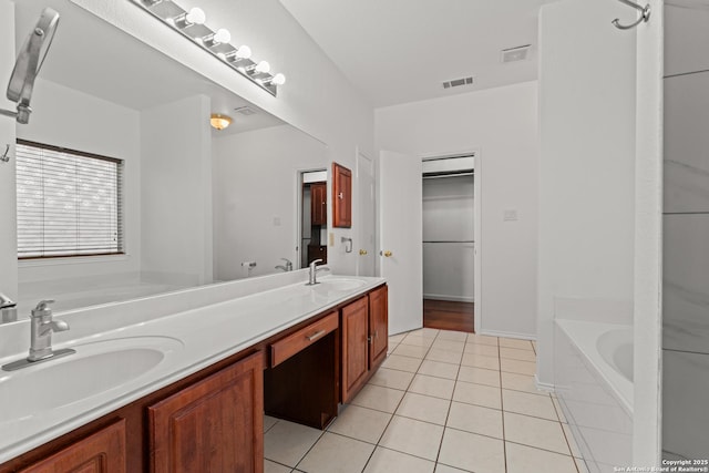 full bathroom with visible vents, a sink, tile patterned flooring, and a washtub