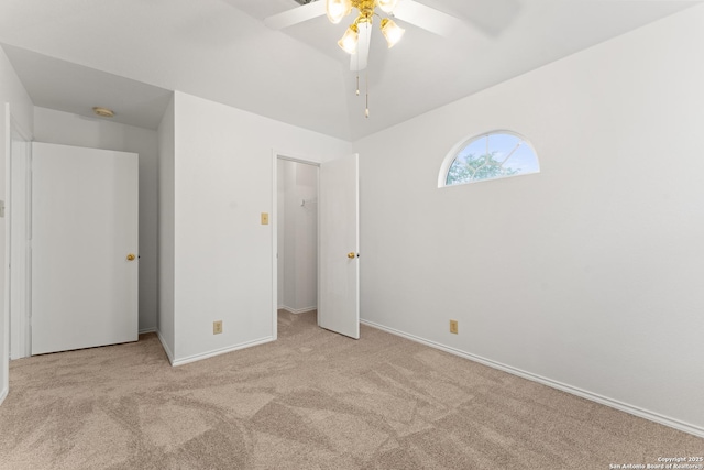 unfurnished bedroom featuring carpet flooring, a ceiling fan, and baseboards