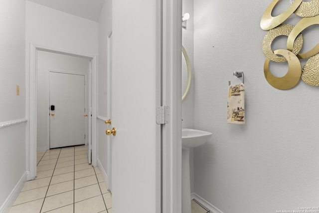 bathroom featuring tile patterned floors and baseboards