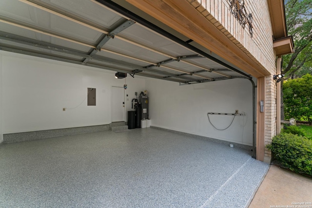 garage featuring electric panel and electric water heater