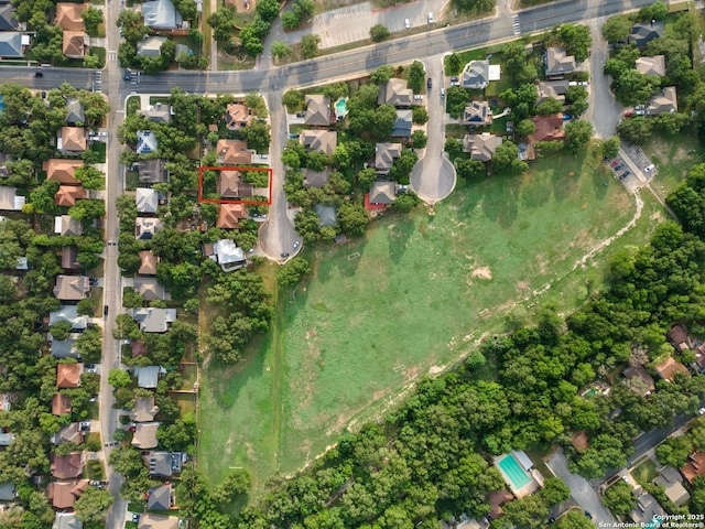 birds eye view of property with a residential view