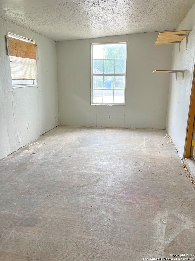 empty room featuring a textured ceiling