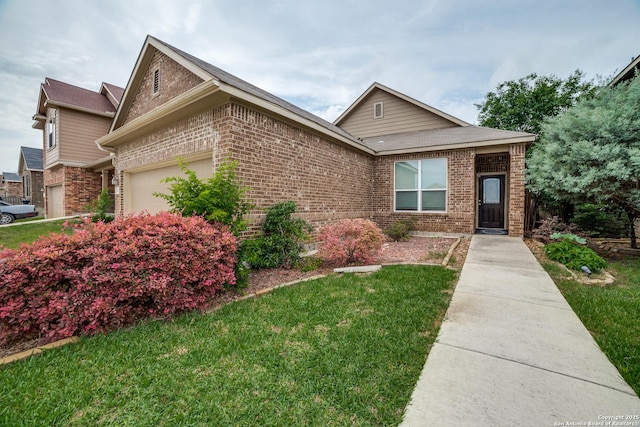 single story home with brick siding, an attached garage, and a front lawn