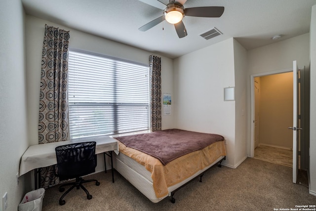 bedroom featuring carpet floors, a ceiling fan, baseboards, and visible vents