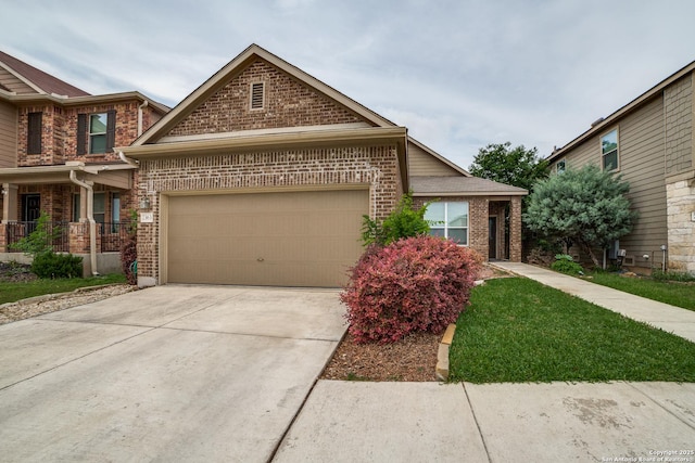 view of front of property with an attached garage, concrete driveway, and brick siding