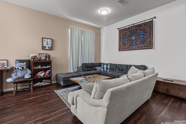 17926 Autumn Knl, San Antonio, TX 78258 - living area with baseboards, visible vents, and wood finished floors