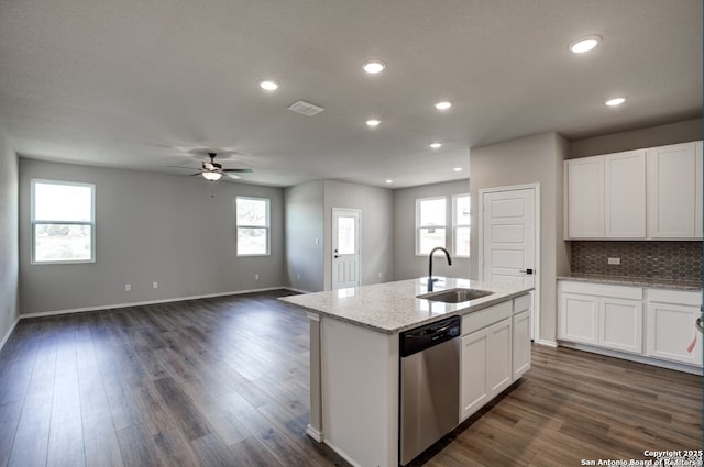 kitchen featuring a ceiling fan, plenty of natural light, a sink, and dishwasher