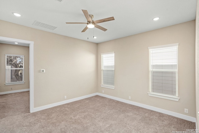 unfurnished room featuring a ceiling fan, visible vents, baseboards, carpet, and recessed lighting