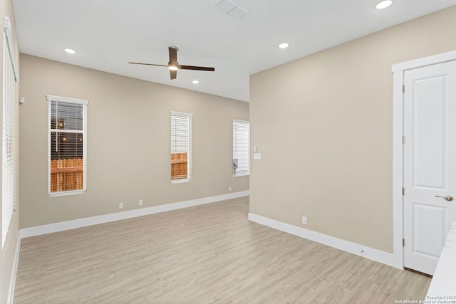 empty room featuring recessed lighting, ceiling fan, visible vents, and light wood-style flooring