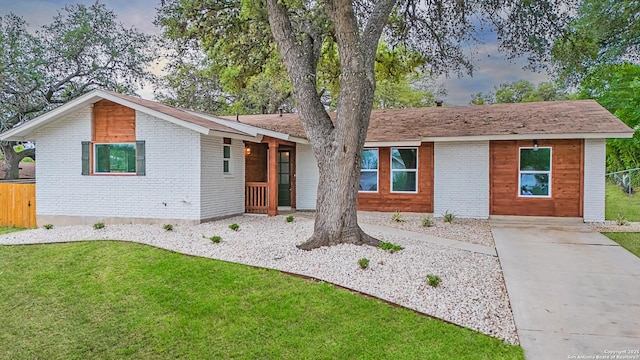 5806 Gillis, San Antonio, TX 78240 - ranch-style home with brick siding, fence, and a front lawn