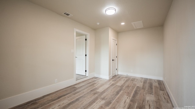 5806 Gillis, San Antonio, TX 78240 - unfurnished room featuring baseboards, recessed lighting, wood finished floors, and visible vents