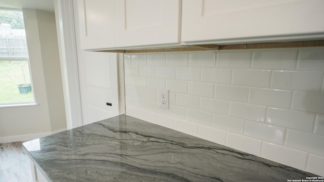5806 Gillis, San Antonio, TX 78240 - laundry room featuring baseboards and wood finished floors