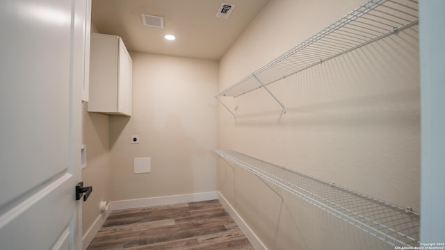 5806 Gillis, San Antonio, TX 78240 - laundry area featuring washer hookup, electric dryer hookup, visible vents, baseboards, and dark wood-style floors