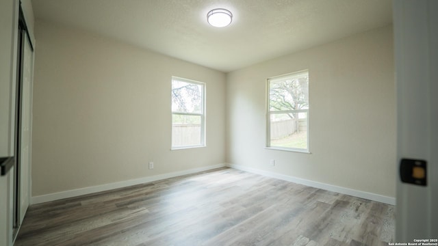 5806 Gillis, San Antonio, TX 78240 - spare room with baseboards and wood finished floors