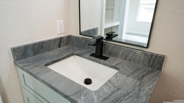 5806 Gillis, San Antonio, TX 78240 - bathroom featuring vanity and a textured wall
