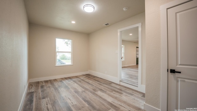 5806 Gillis, San Antonio, TX 78240 - spare room featuring baseboards, wood finished floors, and visible vents