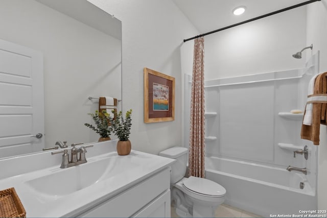 full bath with vanity, tile patterned floors, toilet, and shower / tub combo