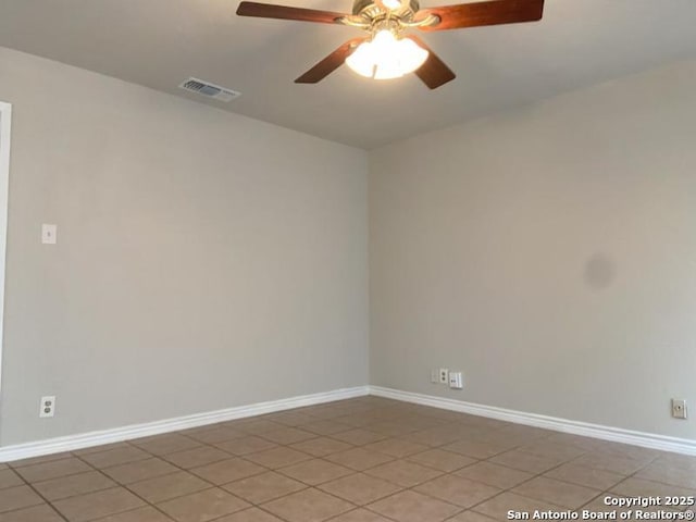 unfurnished room featuring visible vents, baseboards, ceiling fan, and light tile patterned floors